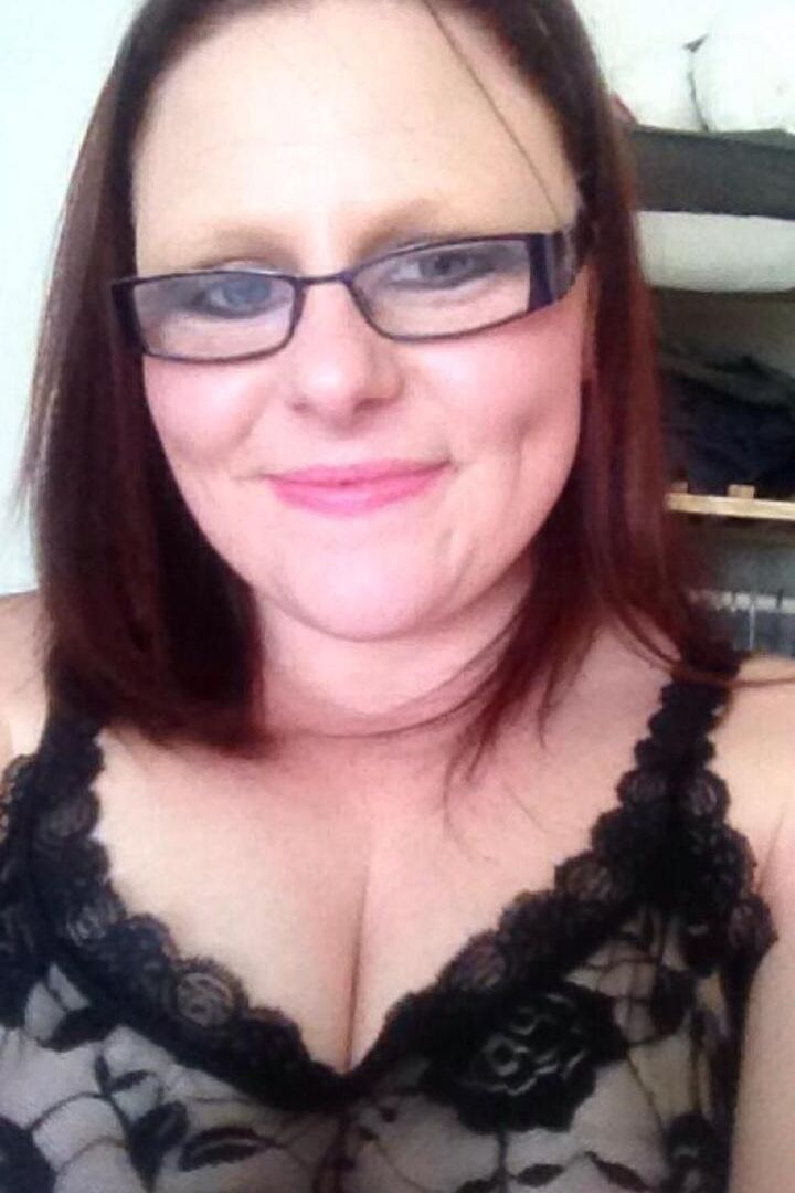 16P Middle-aged redhead Mollie Foxxx displays her shaved pussy with her glasses on