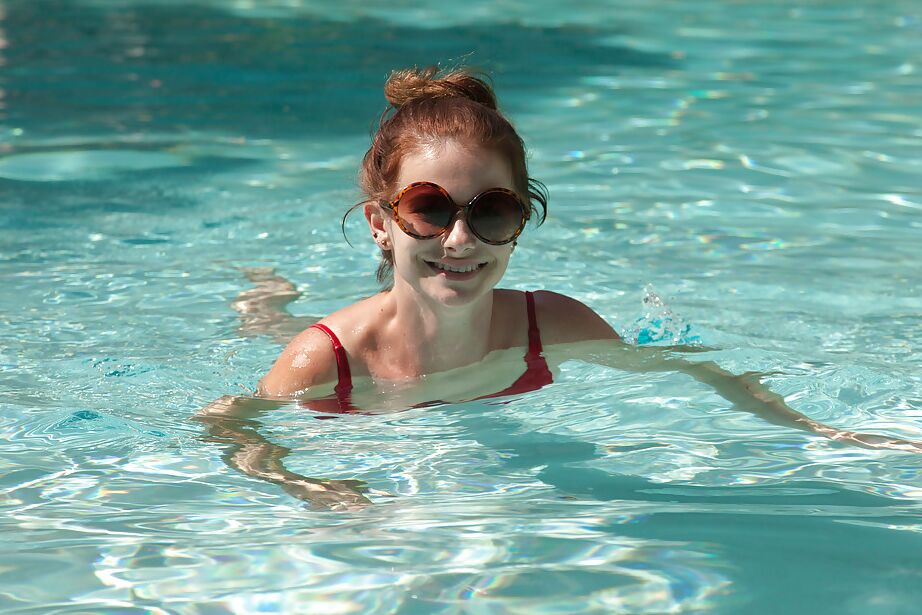 11P Big tit redhead amateur Essie Halladay having fun in a swimming pool