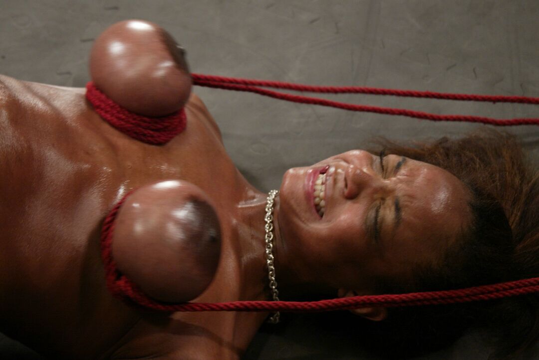 21P Ebony with big boobs Sinnamon Love enjoys a bondage session in a basement