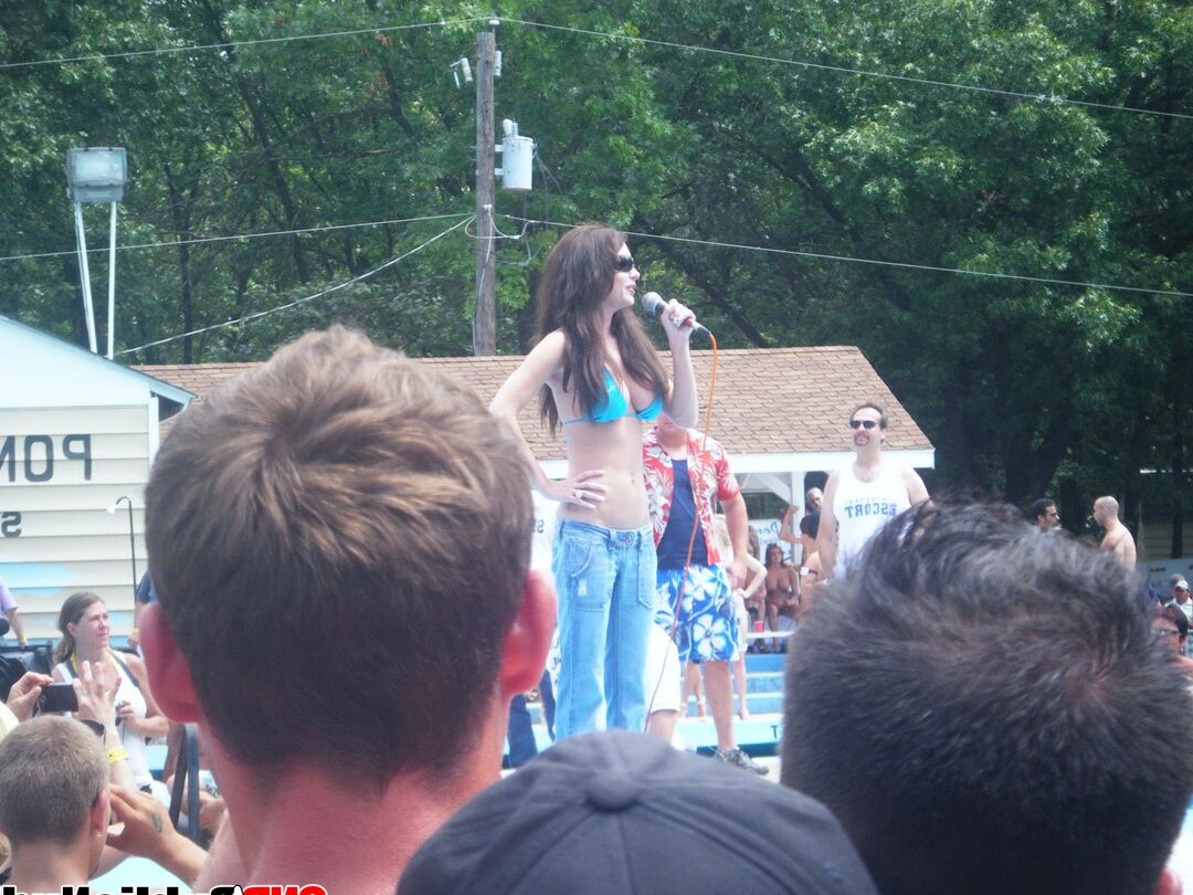 12P Lots of big tit girls stripping on an outdoor stage for all to watch