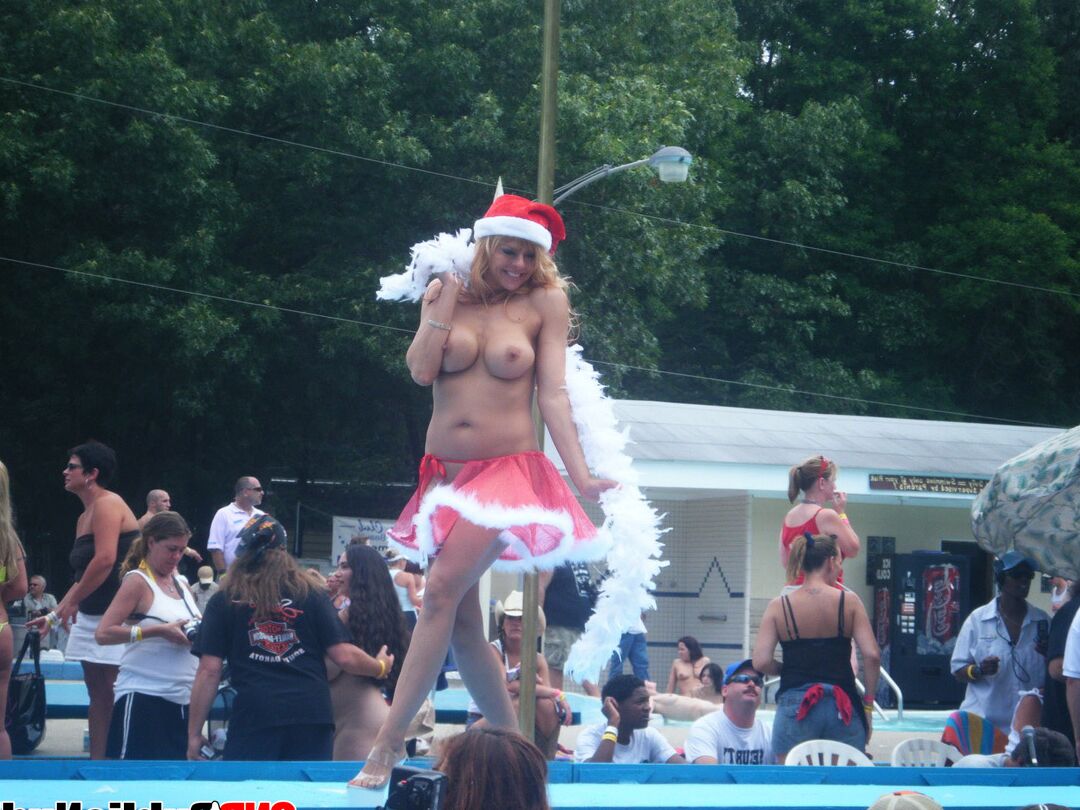 12P Lots of big tit girls stripping on an outdoor stage for all to watch