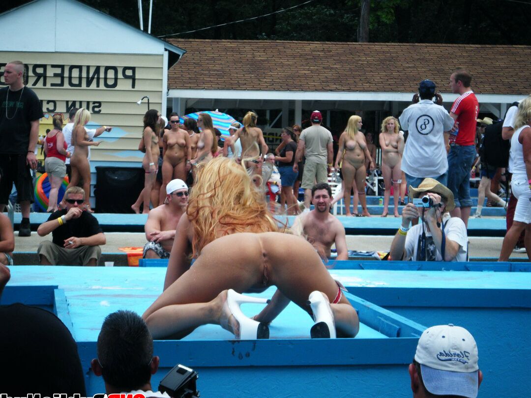 12P Lots of big tit girls stripping on an outdoor stage for all to watch