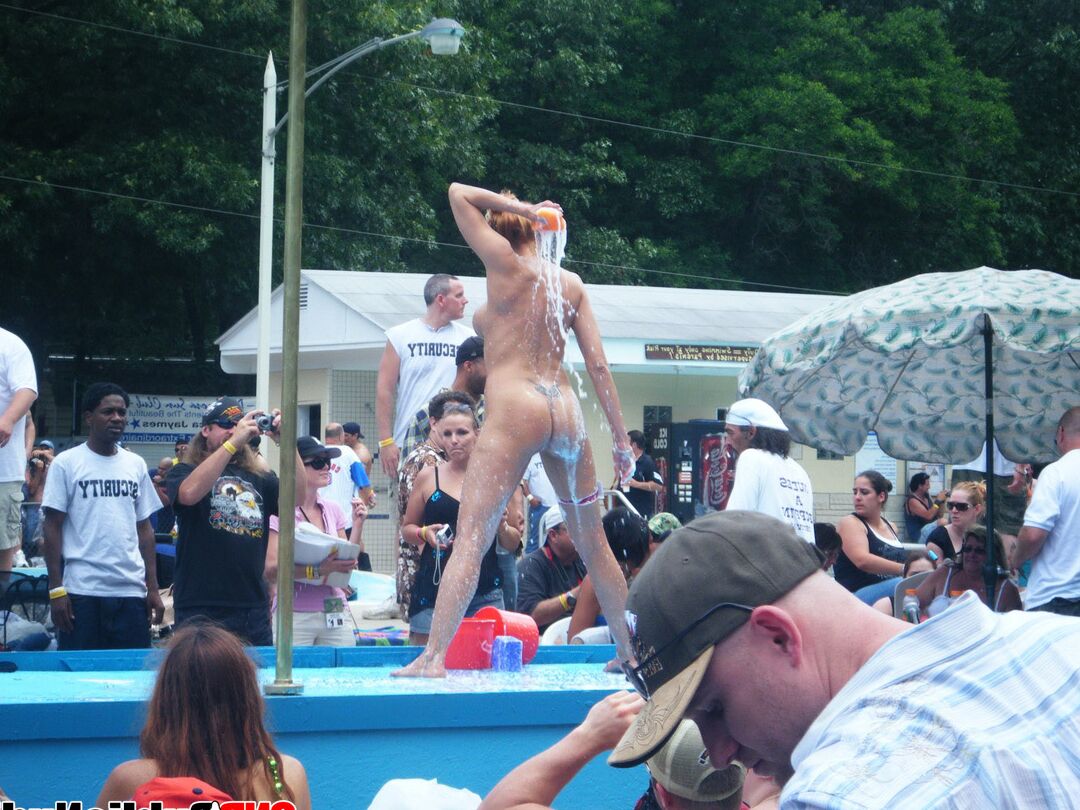 12P Lots of big tit girls stripping on an outdoor stage for all to watch