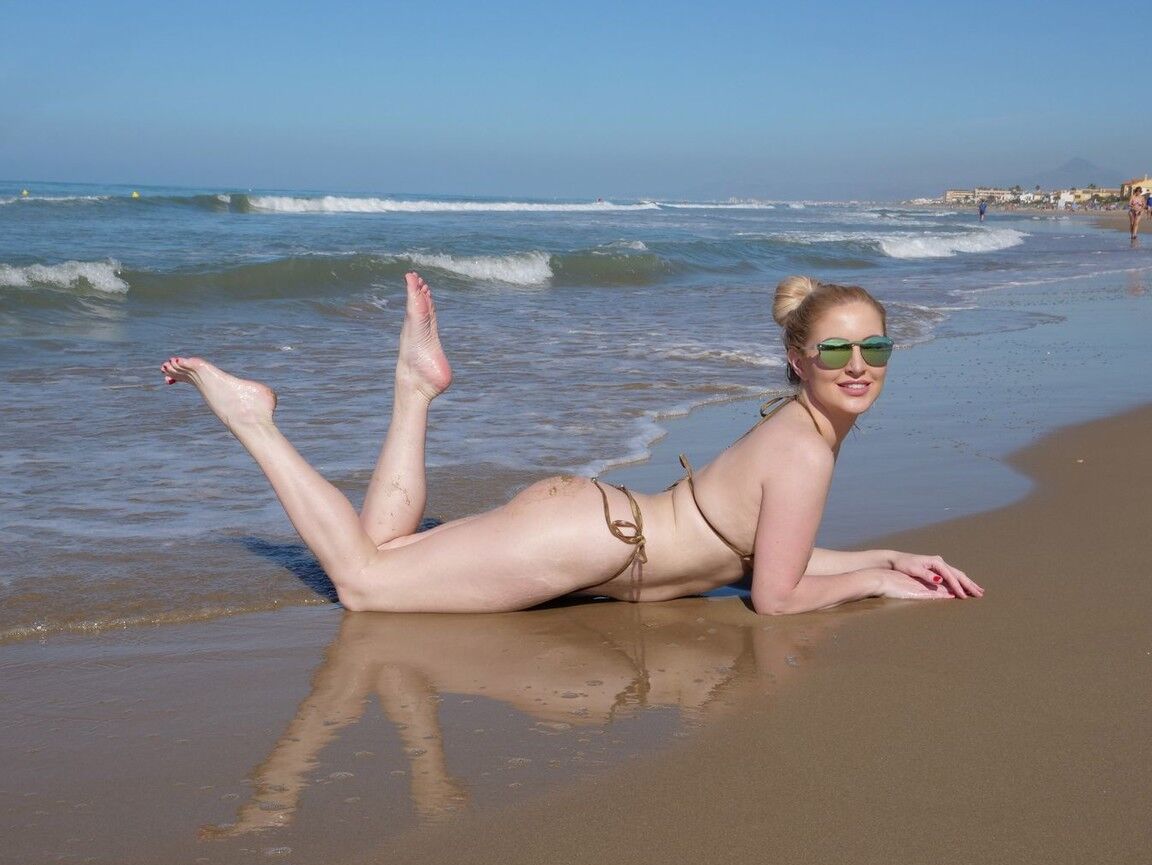12P This blonde micro bikini model loves to wear her naugthy stuff in public and