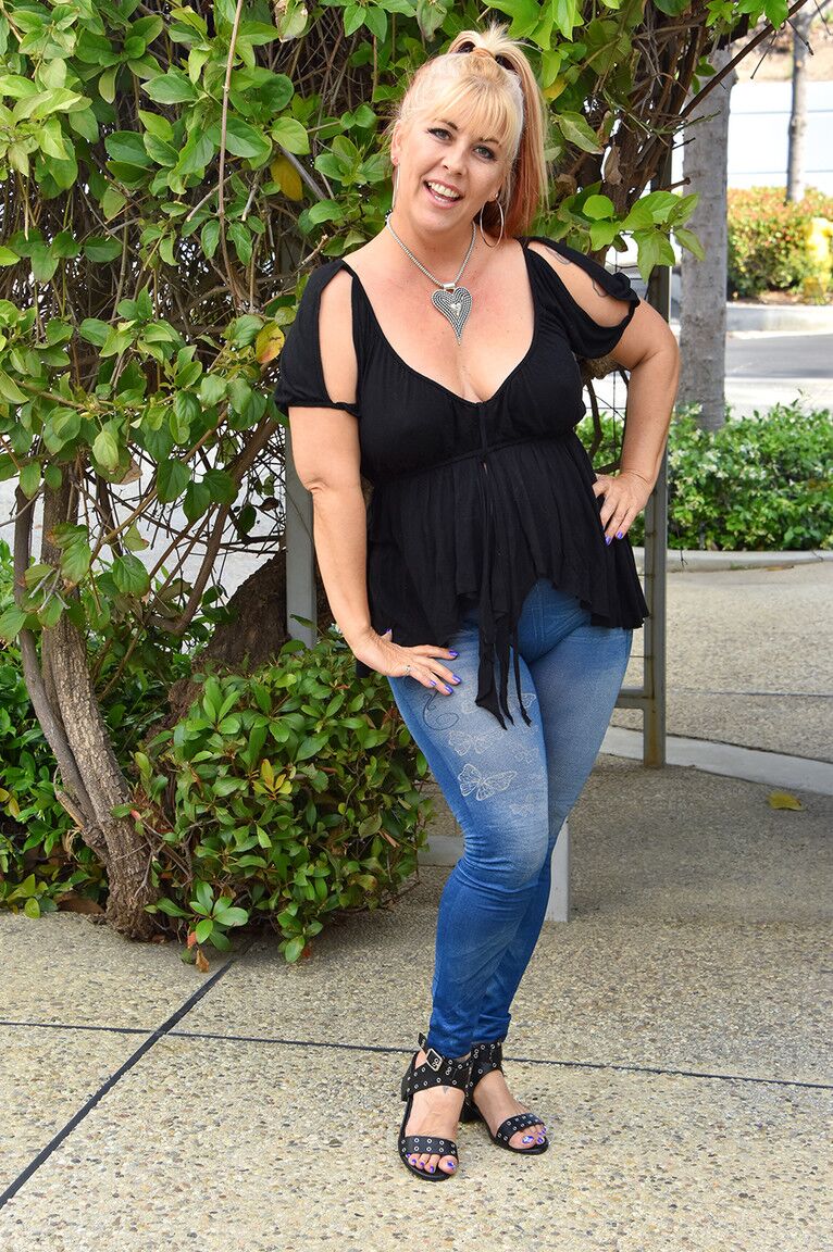 21P Horny mature Joclyn exposes her big juggs and teases with them in public