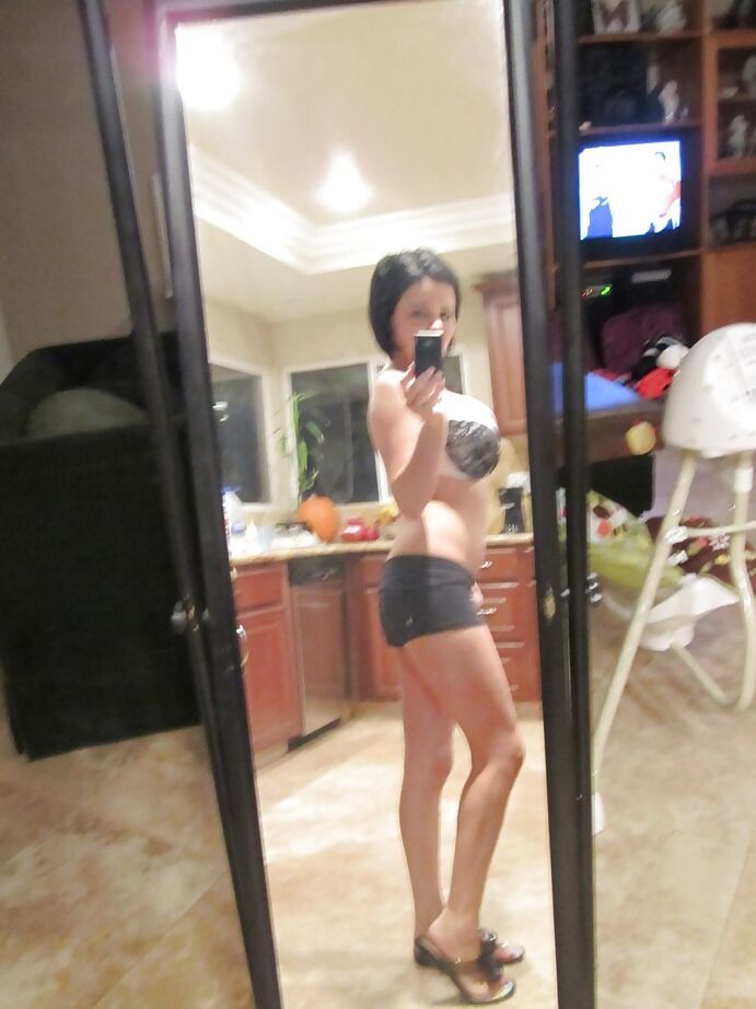 16P Dark haired babe Loni Evans snaps selfies while stripping in front of mirror