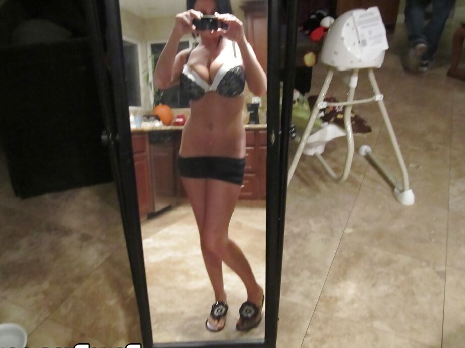 16P Dark haired babe Loni Evans snaps selfies while stripping in front of mirror