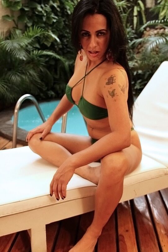 16P Latina chick Nicolle Bitencourt strips off her bikini next to a swimming pool