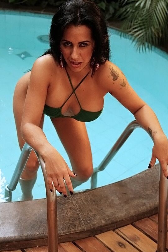 16P Latina chick Nicolle Bitencourt strips off her bikini next to a swimming pool