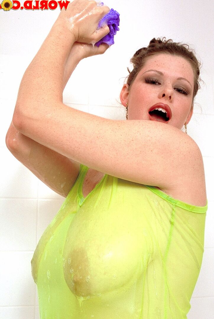 16P Thick girl Desirae soaps up her giant boobs while in a bathtub