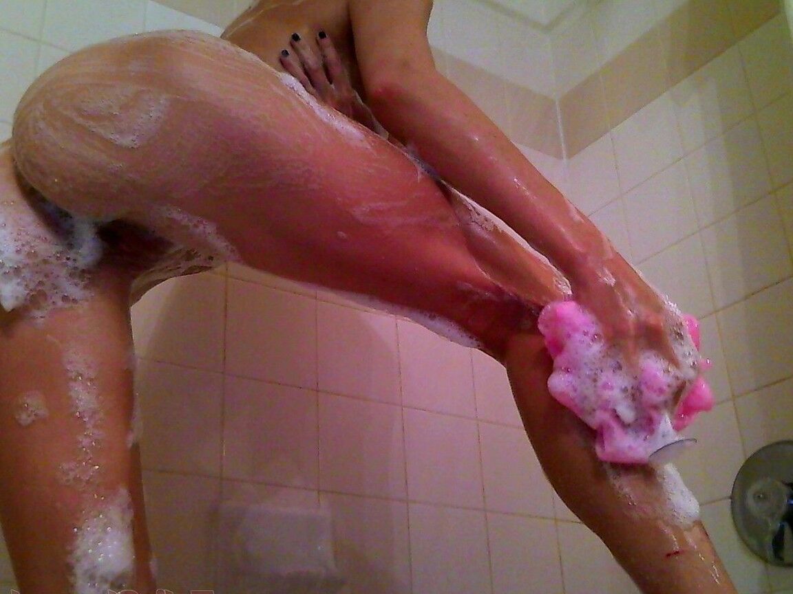 15P Brunette girl Talia Shepard soaks up her fake tits while taking a shower