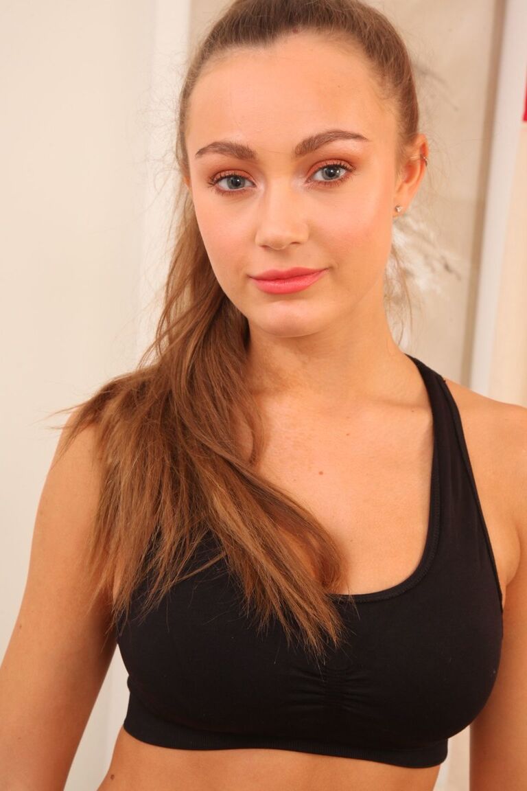 21P Brunette teen with ponytail Zofeya shows her phenomenal breasts and poses