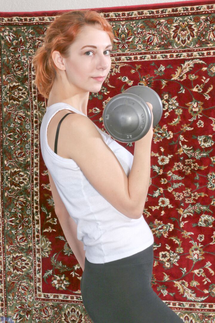 15P Natural redhead Sophia Jeneu pumps iron before getting naked on a trampoline
