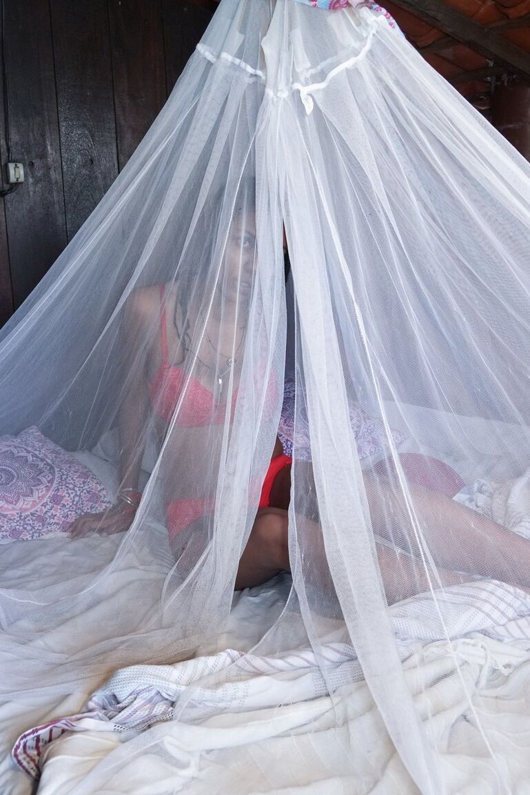 16P Busty black amateur Sofia Cuty emerges from netting to spread her hairy vagina