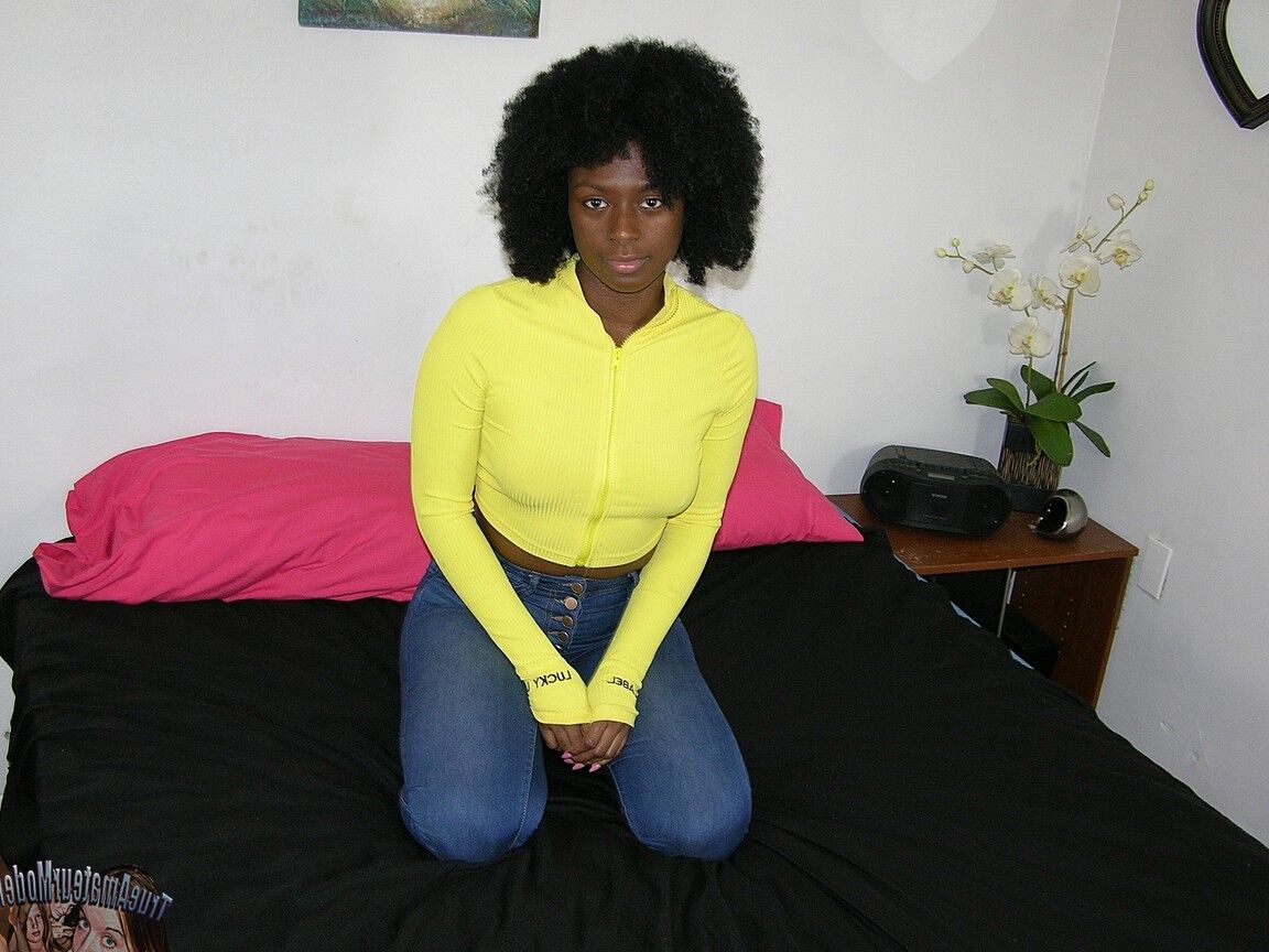16P Black girl Kit K sports an afro while making her nude modelling debut