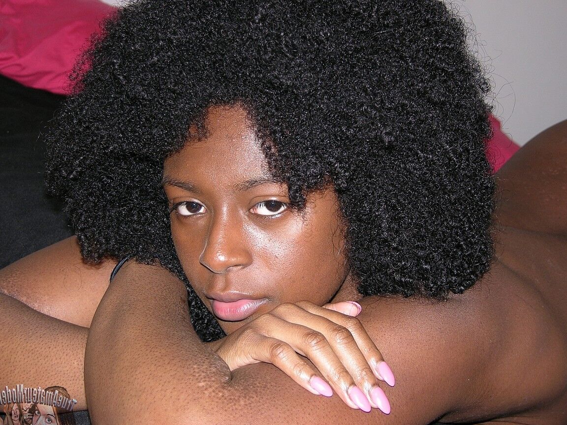 16P Black girl Kit K sports an afro while making her nude modelling debut