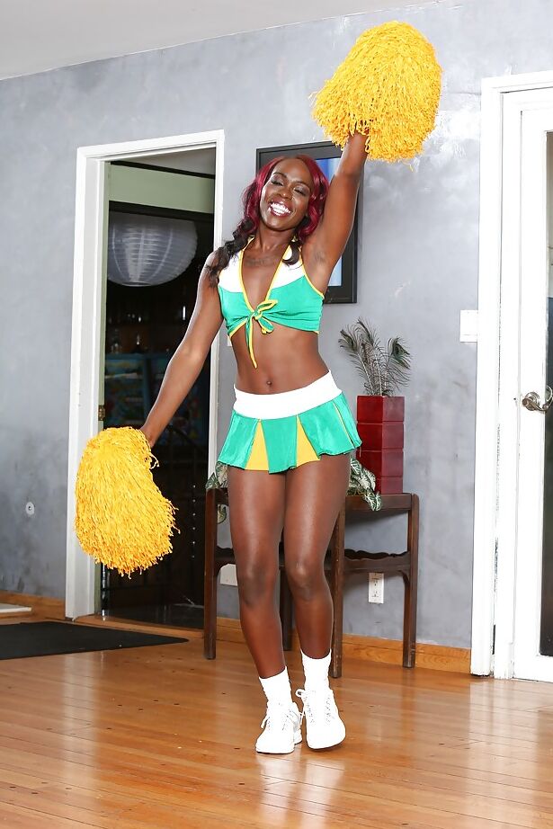 16P Black-skinned cheerleader Bella Doll is dancing naked on the camera