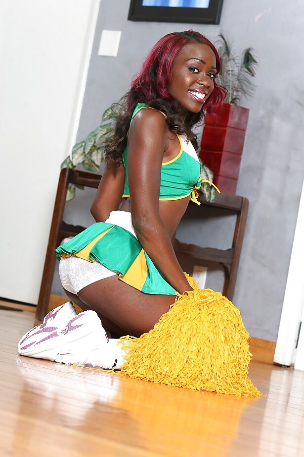 16P Black-skinned cheerleader Bella Doll is dancing naked on the camera