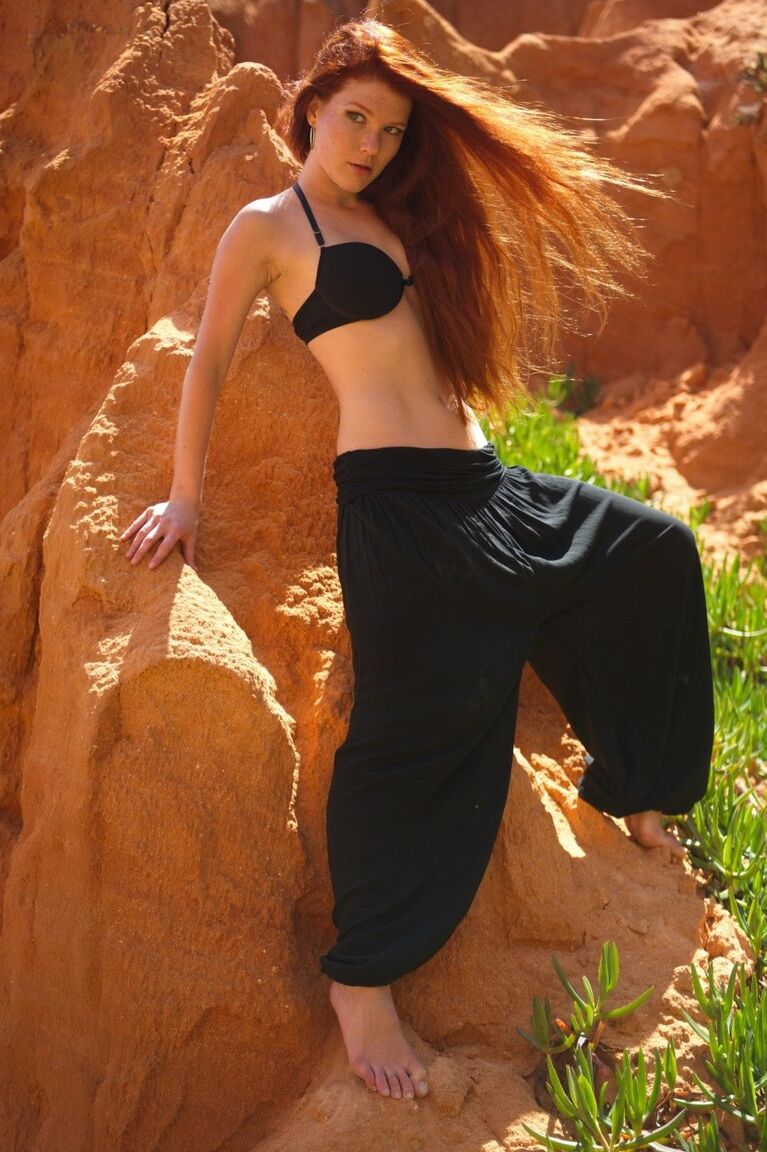 12P Natural redhead Mia Sollis strikes a yoga pose while getting naked in nature