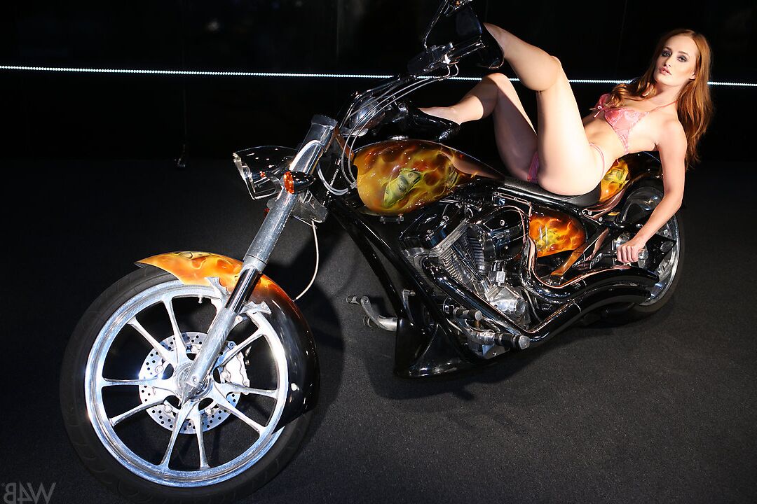 16P Glamour model Heaven poses naked on top of a motorcycle at night