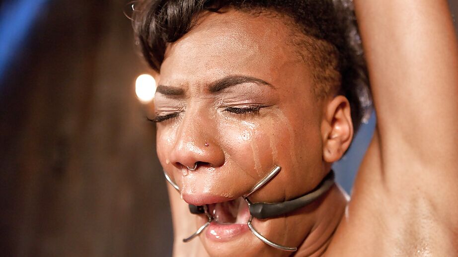 16P Ebony BDSM model Nikki Darling has her labia lips stretched to max
