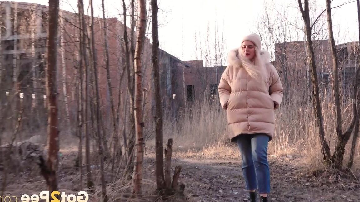 15P Blonde girl Masha Sweet takes a piss in an abandoned building on a cold day