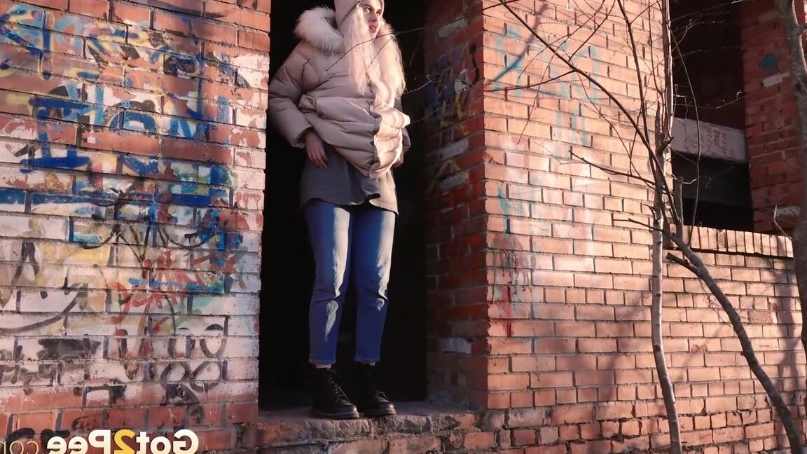 15P Blonde girl Masha Sweet takes a piss in an abandoned building on a cold day