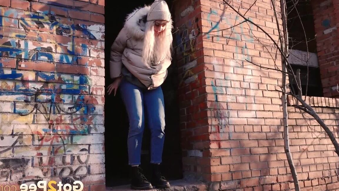 15P Blonde girl Masha Sweet takes a piss in an abandoned building on a cold day