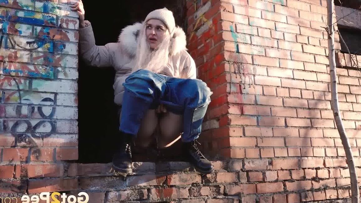 15P Blonde girl Masha Sweet takes a piss in an abandoned building on a cold day