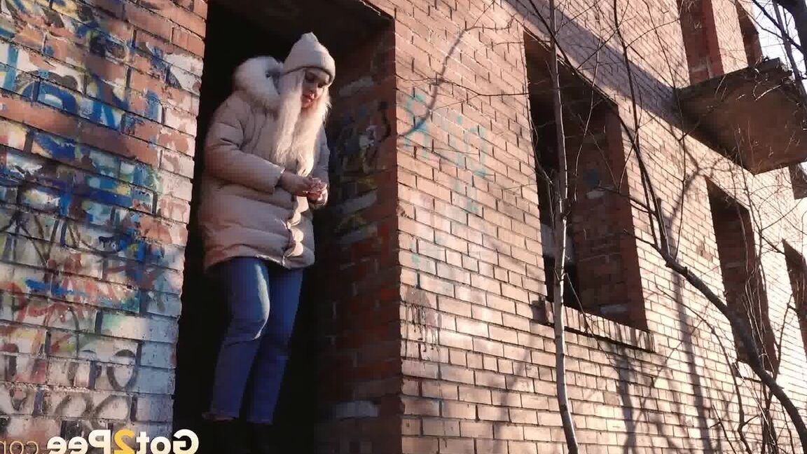 15P Blonde girl Masha Sweet takes a piss in an abandoned building on a cold day