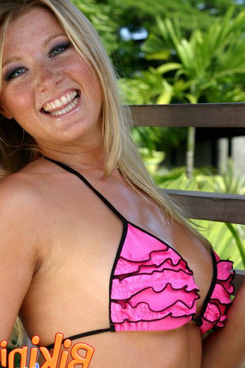15P Natural blonde Lara casts sultry looks while modeling by herself in a bikini