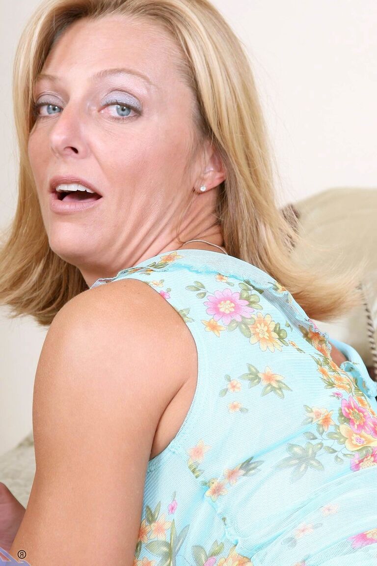 21P Mature honey Brenda James shows her big fakes and fingers her clam in a solo