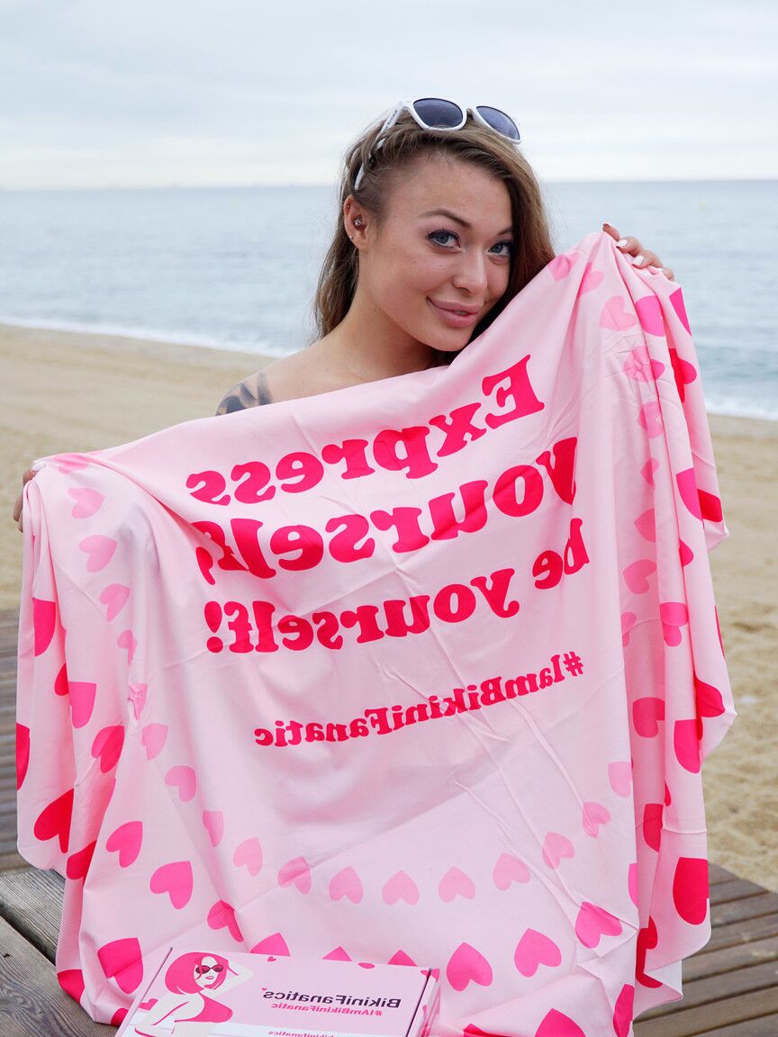 12P Misha is a naughty bikini model who loves to unwrap new gifts and show of her
