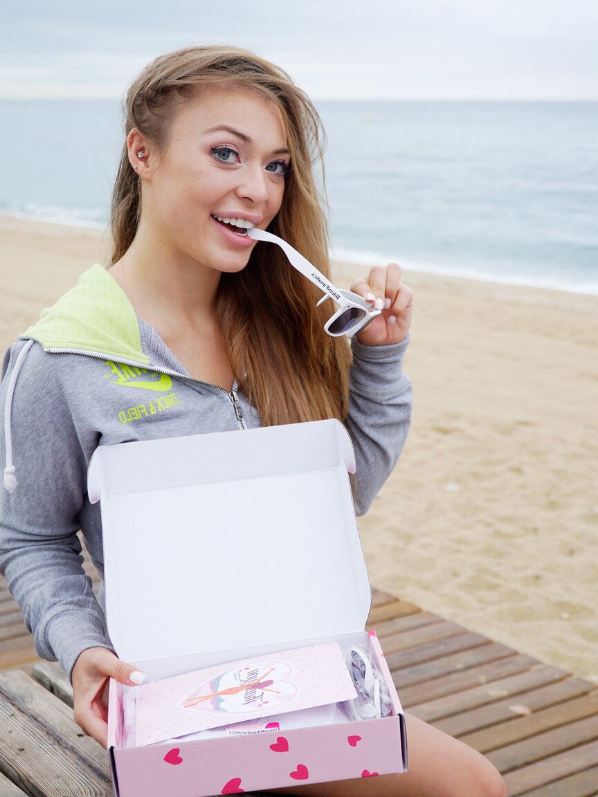 12P Misha is a naughty bikini model who loves to unwrap new gifts and show of her