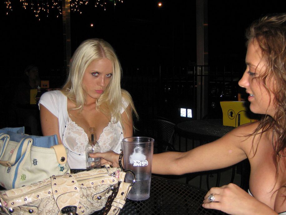 12P Amateur model Megan Summers gets some help adjusting clothes from a girlfriend