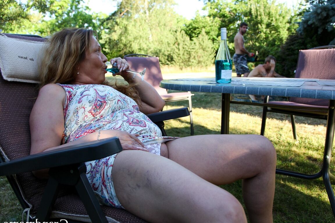 21P Horny mature with big juggs enjoys two young dongs in the back yard