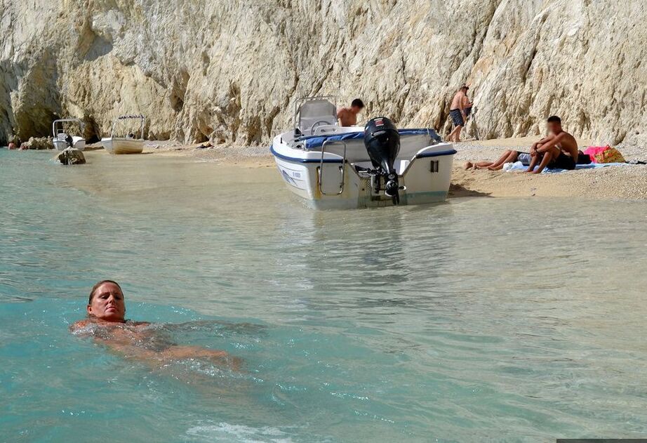 19P Hugely busty mature slut Chrissy swims and lounges at the beach stark naked