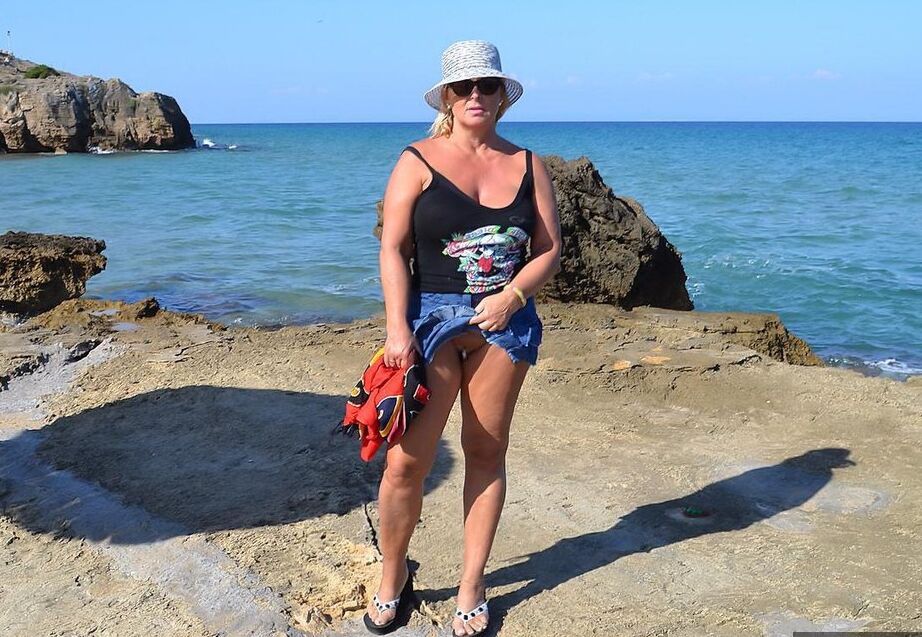 19P Hugely busty mature slut Chrissy swims and lounges at the beach stark naked