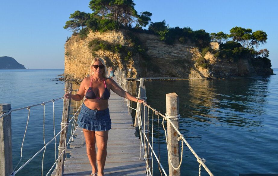 19P Hugely busty mature slut Chrissy swims and lounges at the beach stark naked