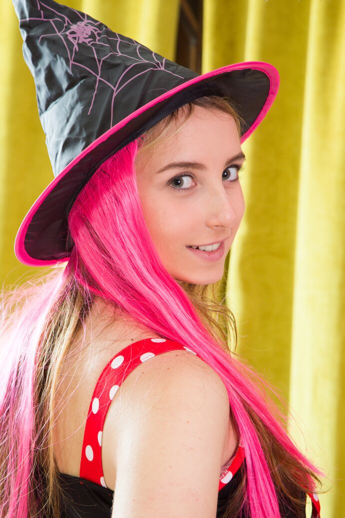 20P Cute teen Lissa sinks a couple of fingers in her tight slit in a witch's hat