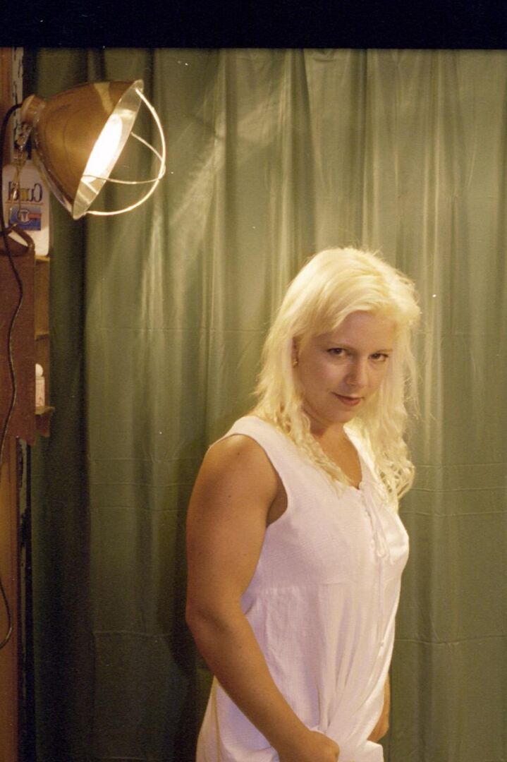 20P Blonde woman exposes her clitoris while taking a piss on toilet in mesh nylons
