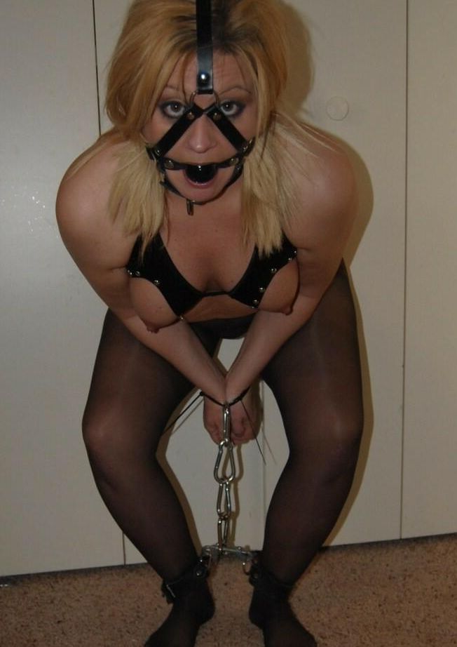16P Blonde BBW displays her exposed breasts while ball gagged and restrained