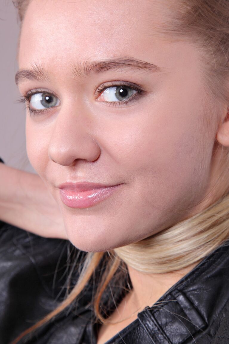 21P Charming teen Sara B exposes her little bush while teasing in a leather jacket