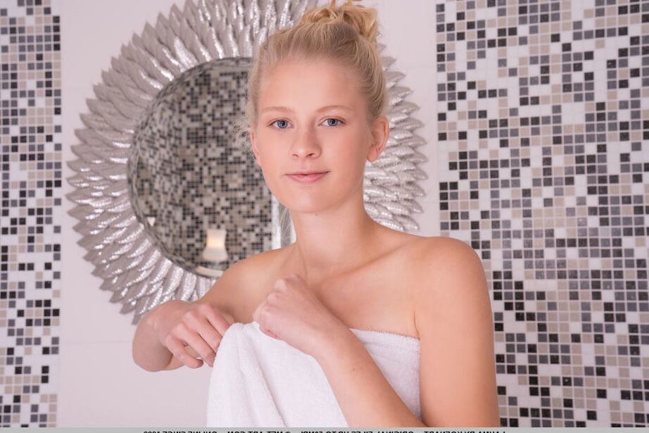 18P Young looking blonde Lauma removes a bath towel before getting in the bathtub