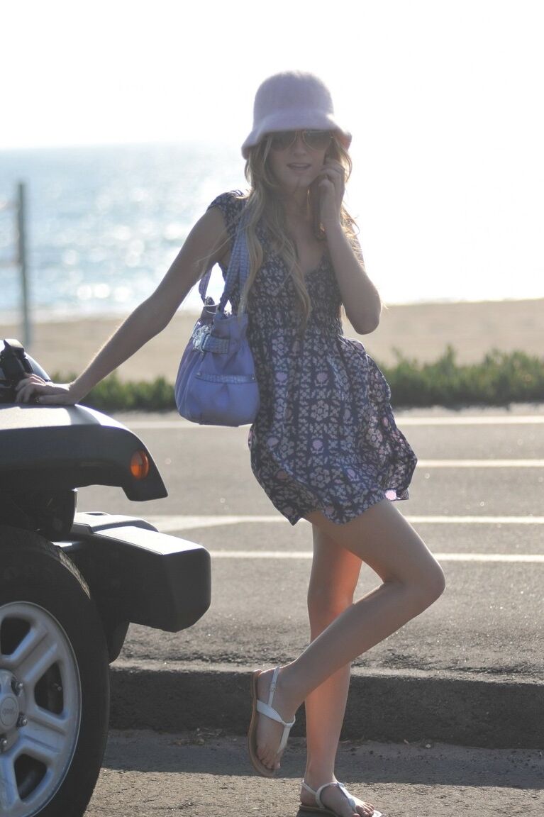 12P Dirty blond girl Sarah James flashes upskirts while going barefoot at beach