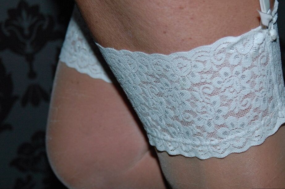 20P Old blond Kyras Nylons models white 3 piece lingerie after coming in from snow