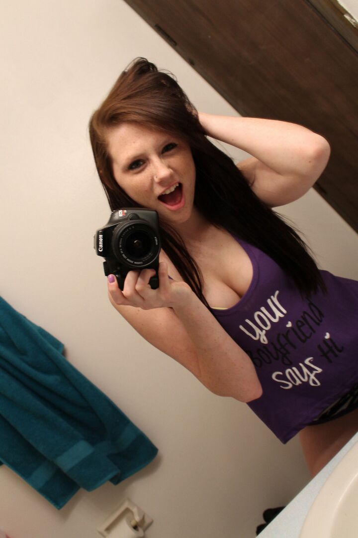 12P Amateur chick Freckles 18 sticks out her tongue while taking mirror selfies