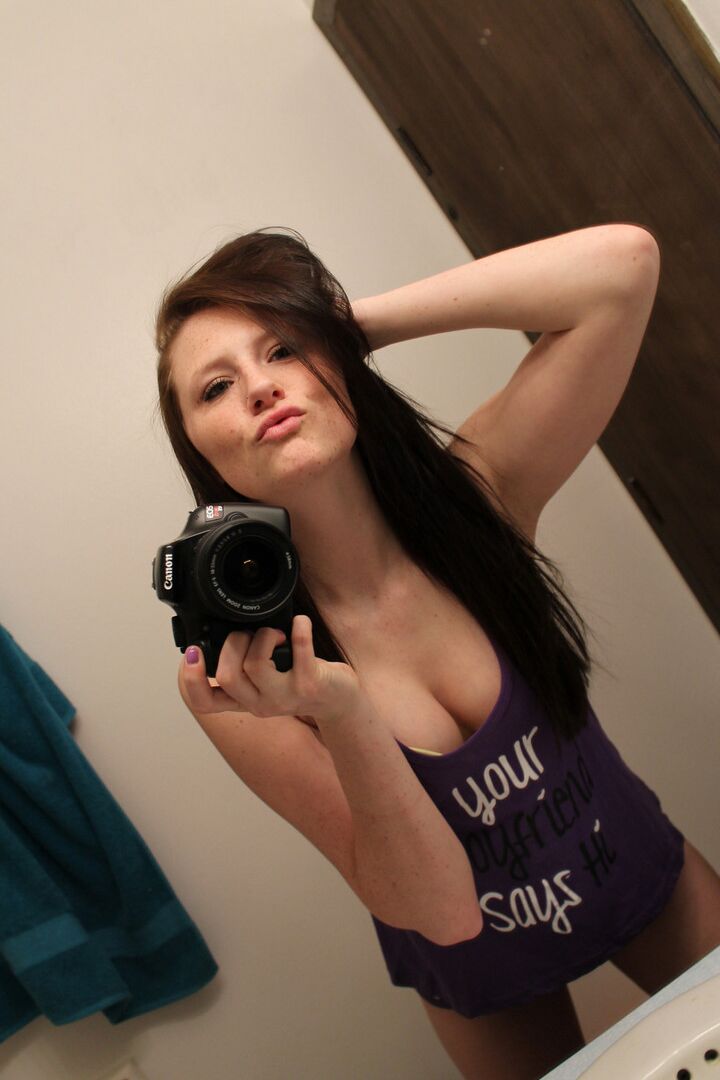 12P Amateur chick Freckles 18 sticks out her tongue while taking mirror selfies