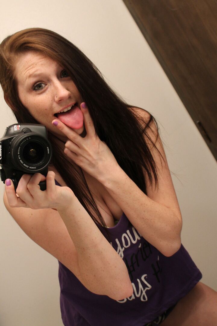 12P Amateur chick Freckles 18 sticks out her tongue while taking mirror selfies