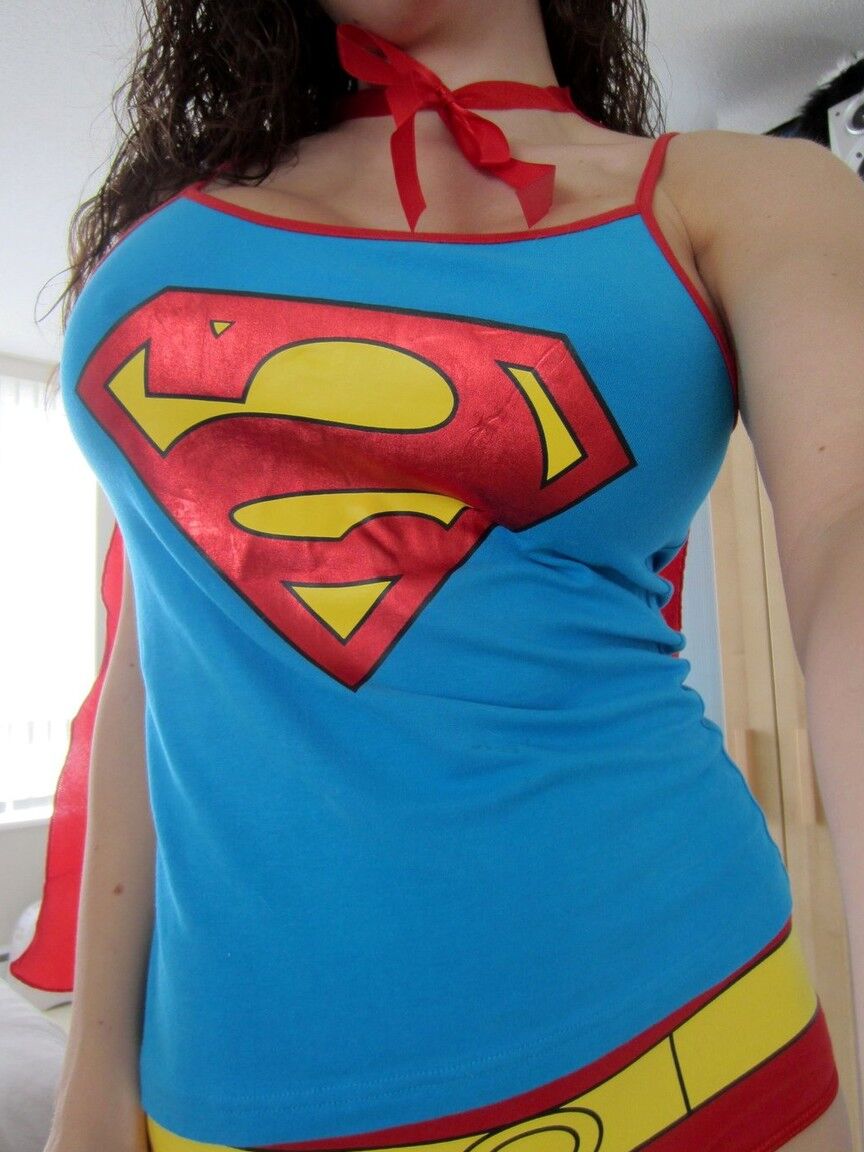 15P Amateur Katie Banks frees fakes tits from Superman outfit while taking selfies
